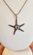 Load image into Gallery viewer, Sterling silver starfish pendant with blue topaz