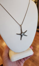 Load image into Gallery viewer, Sterling silver starfish pendant with blue topaz
