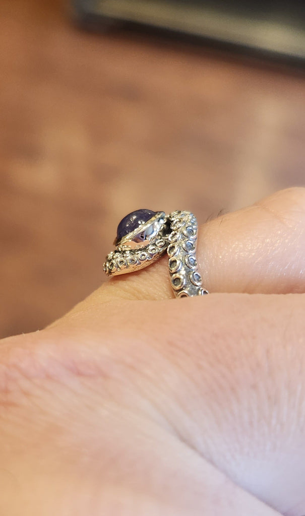 Sterling silver tentacle ring with tanzanite.