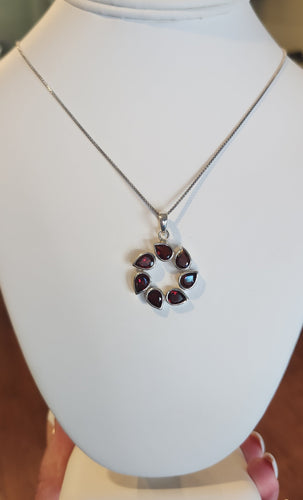 Sterling silver pear-shaped garnet circle pendant