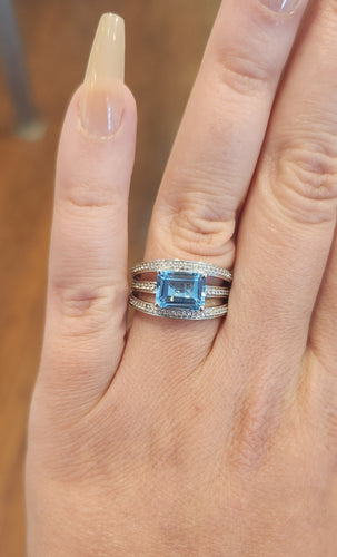 Sterling silver triple band blue topaz ring with diamonds