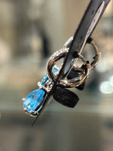 Load image into Gallery viewer, Sterling silver pear shaped blue topaz dangle hoop earrings