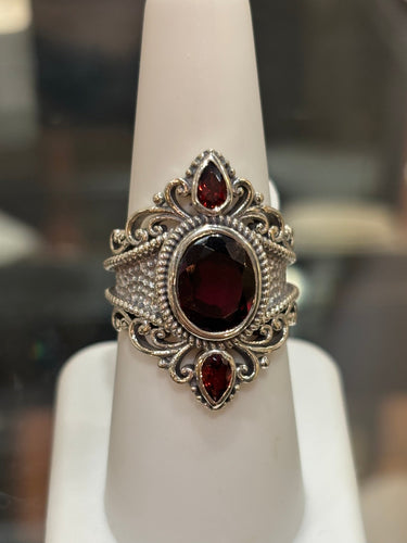 Sterling silver three stone garnet statement ring