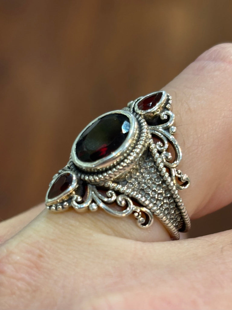 Sterling silver three stone garnet statement ring