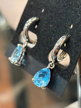 Load image into Gallery viewer, Sterling silver pear shaped blue topaz dangle hoop earrings